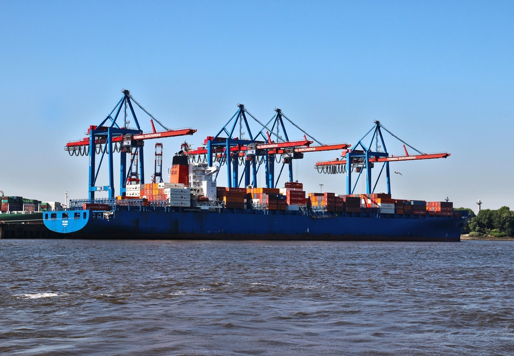 Container ship being loaded at a port terminal
